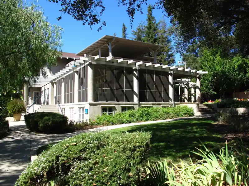 Screened lanai enclosure with mansard roof attached to a Tampa Bay home